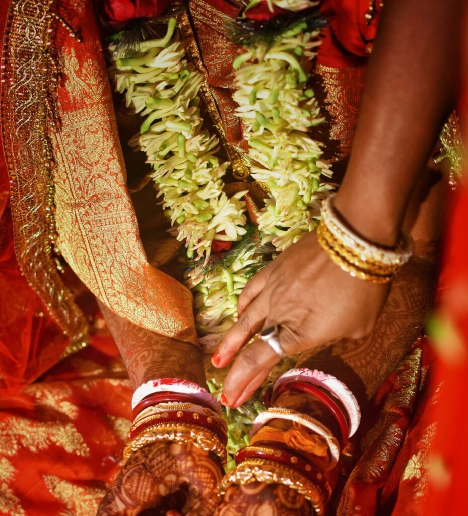 Kishore & Sravani. shakha pola conch shell red coral bangles 2026 01 06 09 51 06 utc