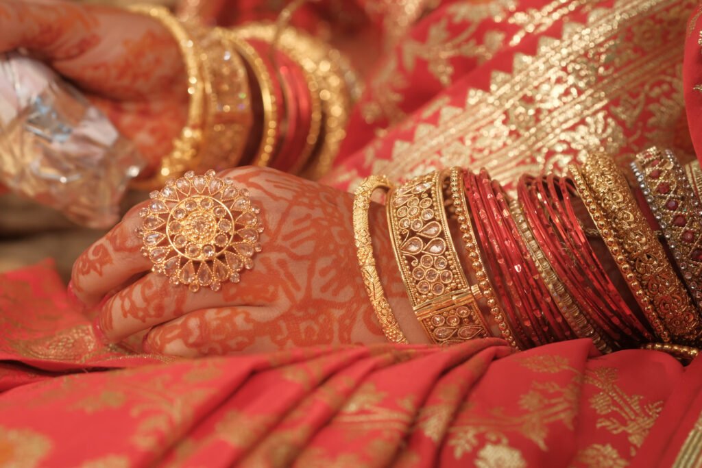 the artistry of a traditional indian bridal hand with mehndi and bangles captures cultural essence